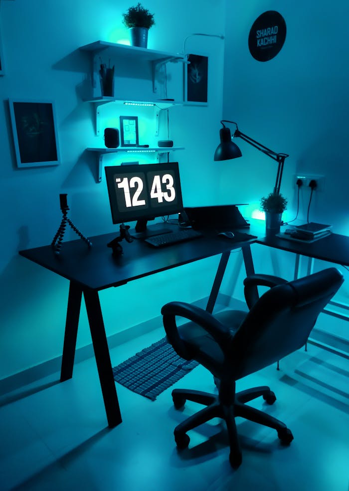 gallery-5 Contemporary home office setup featuring blue LED lighting and sleek design elements.